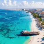 Palm Beach Aruba Caribbean, white long sandy beach with palm trees at Aruba Antilles